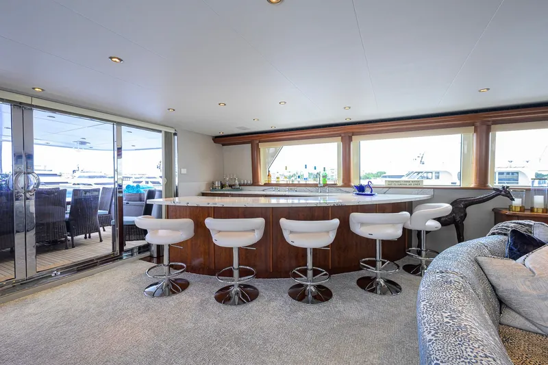Slide: The Image of Luxurious interior of 2003 Cheoy Lee Trideck yacht with modern bar and seating area. - 51
