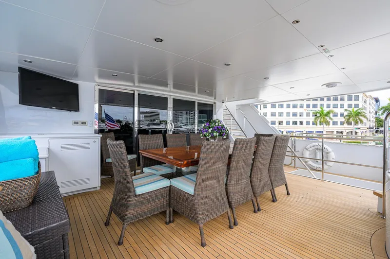 Slide: The Image of Luxurious 2003 Cheoy Lee Trideck yacht deck with dining area and TV. - 54