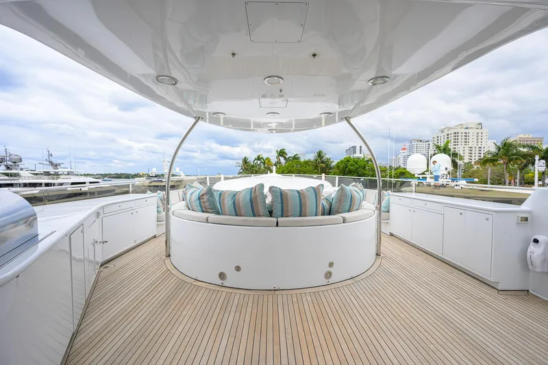Slide: The Image of Luxurious 2003 Cheoy Lee Trideck yacht deck with seating and scenic marina view. - 57