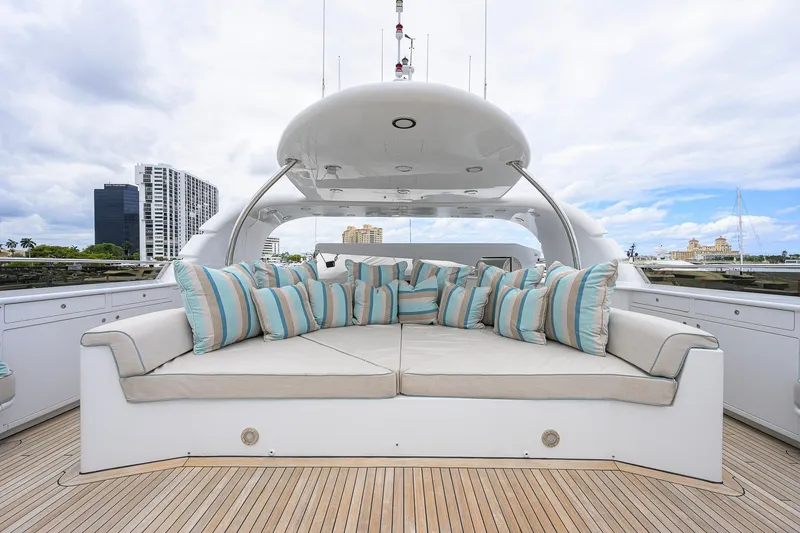Slide: The Image of Luxurious 2003 Cheoy Lee Trideck yacht deck with plush seating and striped cushions. - 61
