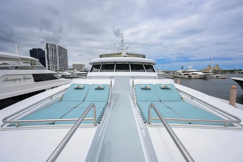Slide: The Image of Luxurious 2003 Cheoy Lee Trideck yacht with sun loungers docked at marina. - 65