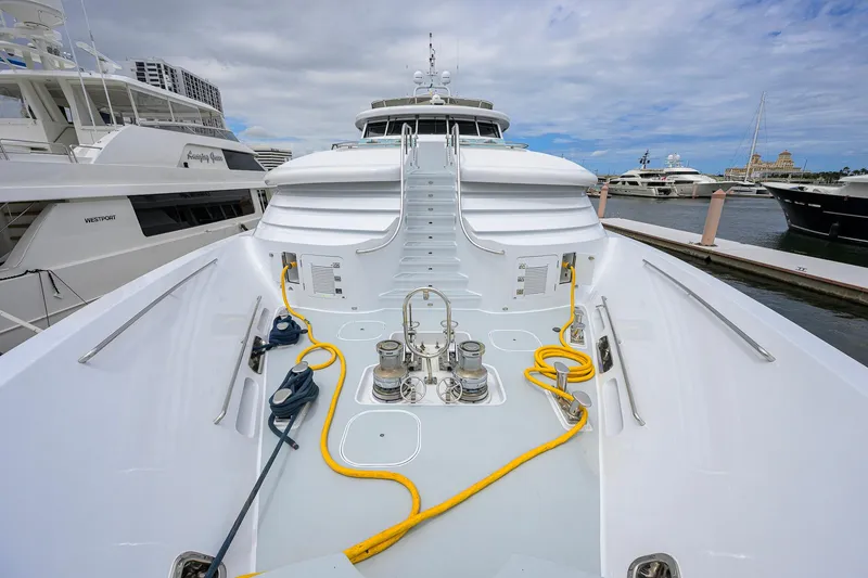 Slide: The Image of 2003 Cheoy Lee Trideck yacht docked, showcasing deck equipment and marina view. - 66