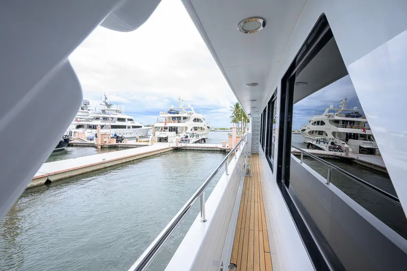 Slide: The Image of Side deck view of 2003 Cheoy Lee Trideck yacht in marina. - 67