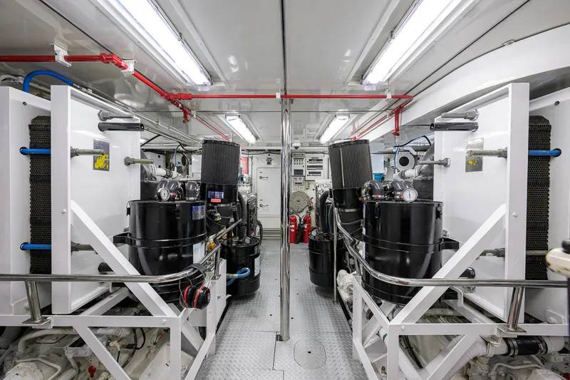 Slide: The Image of Engine room of 2003 Cheoy Lee Trideck yacht, featuring machinery and equipment. - 70