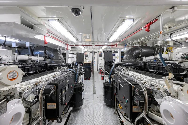 Slide: The Image of Engine room of 2003 Cheoy Lee Trideck yacht, featuring dual engines and modern equipment. - 73