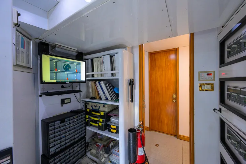 Slide: The Image of Control room of 2003 Cheoy Lee Trideck yacht with equipment and storage shelves. - 74