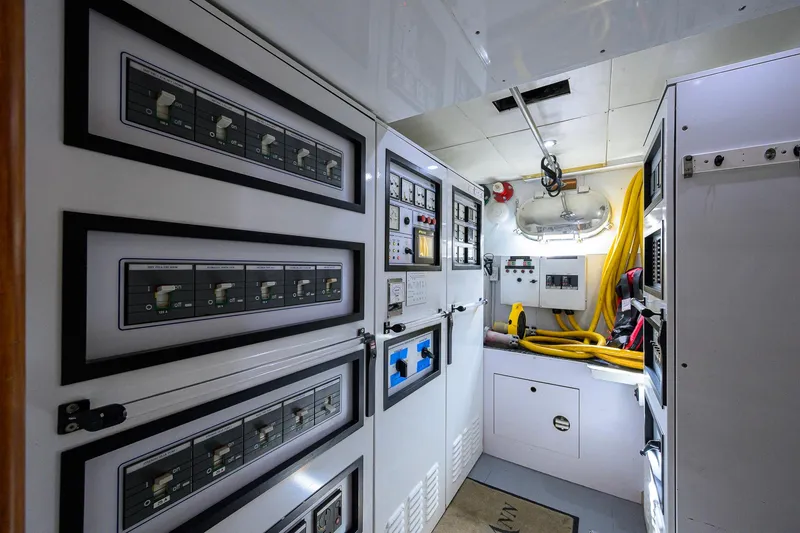 Slide: The Image of Electrical control room on a 2003 Cheoy Lee Trideck yacht, featuring panels and equipment. - 75