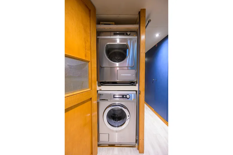Slide: The Image of Stacked washer and dryer in 2003 Cheoy Lee Trideck yacht interior. - 77