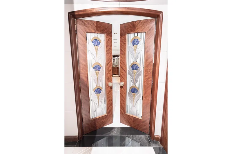 Slide: The Image of Elegant wooden doors with stained glass design on a 2003 Cheoy Lee Trideck yacht. - 8