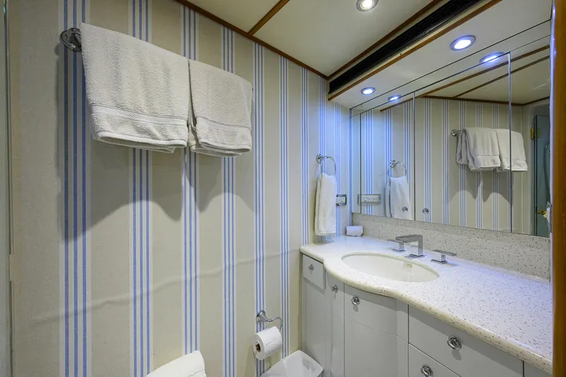 Slide: The Image of Luxurious Cheoy Lee Trideck 2003 yacht bathroom with striped wallpaper and elegant fixtures. - 81