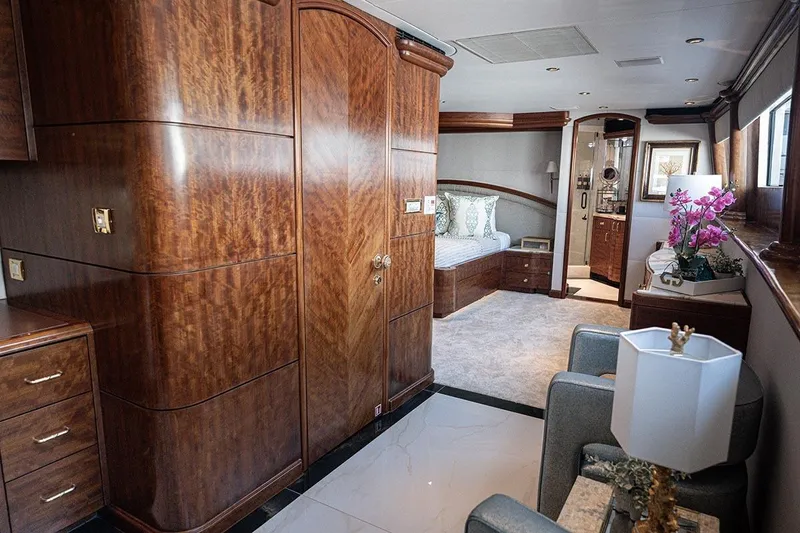 Slide: The Image of Luxurious 2003 Cheoy Lee Trideck yacht interior with elegant wood paneling and plush furnishings. - 9