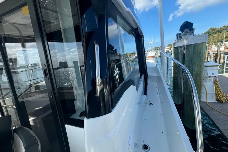 Slide: The Image of 2024 Jeanneau NC Weekender 1095 Fly docked, showcasing sleek design and modern features. - 10