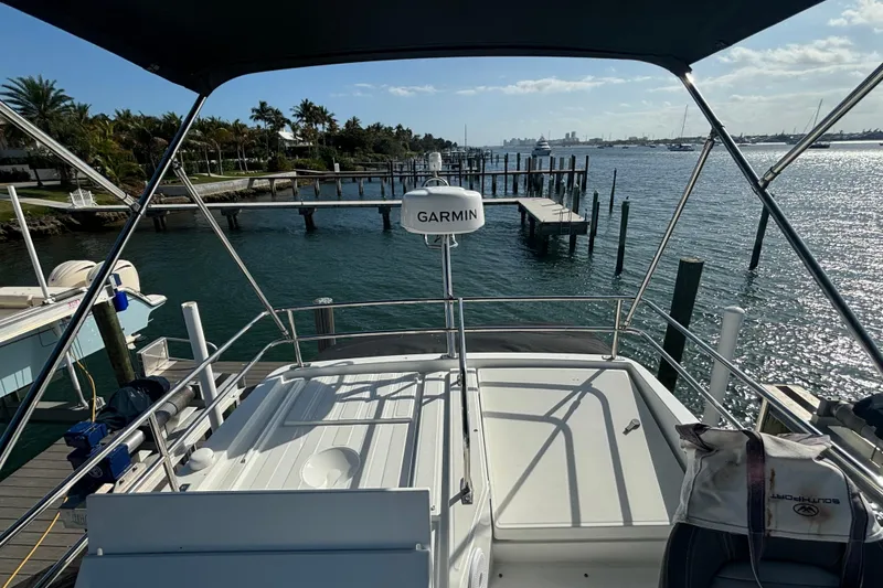 Slide: The Image of 2024 Jeanneau NC Weekender 1095 Fly, docked with scenic waterfront view. - 28