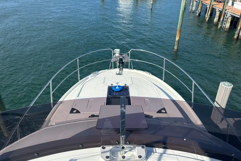 Slide: The Image of 2024 Jeanneau NC Weekender 1095 Fly yacht docked on calm water. - 4