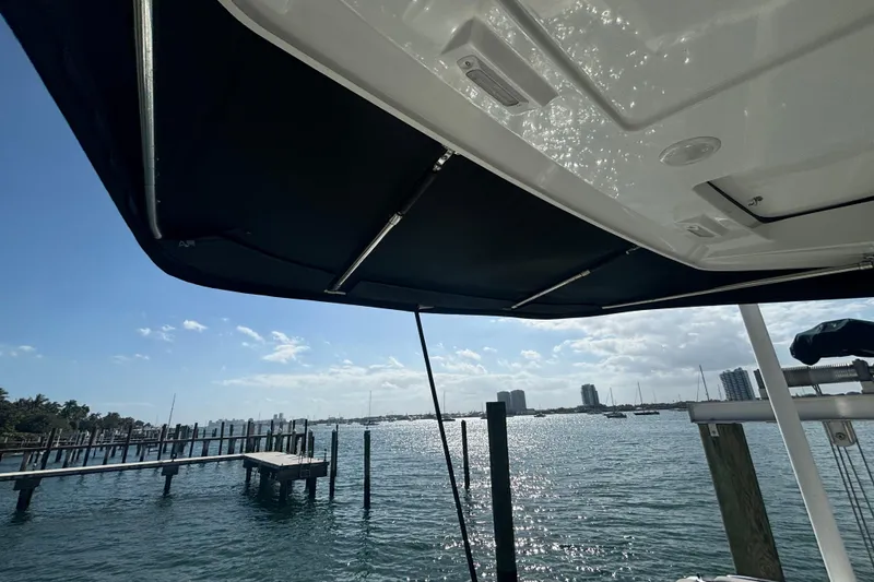 Slide: The Image of 2024 Jeanneau NC Weekender 1095 Fly, docked with scenic waterfront view. - 8