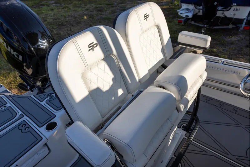 Slide: The Image of 2024 Sea Pro 210 Bay boat seats with elegant white upholstery and armrests. - 10