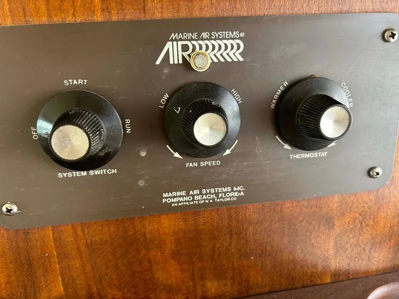 Slide: The Image of Control panel of a 1975 Hatteras 36 Convertible boat's air system. - 12