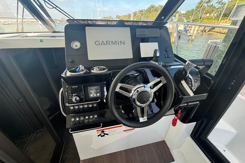 Slide: The Image of 2024 Jeanneau NC Weekender 1095 Fly helm with Garmin navigation system and controls. - 17