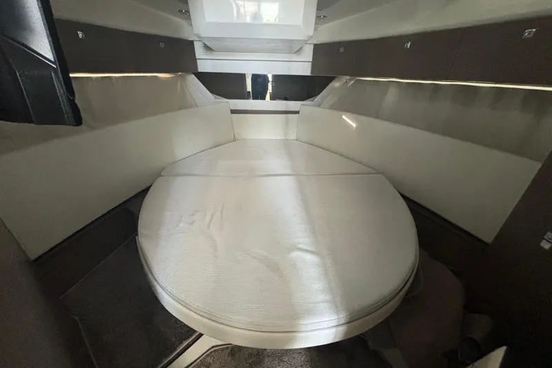 Slide: The Image of 2024 Jeanneau NC Weekender 1095 Fly cabin interior with spacious bed and modern design. - 18