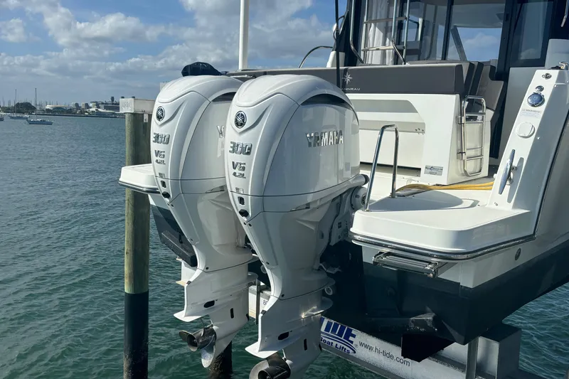 Slide: The Image of 2024 Jeanneau NC Weekender 1095 Fly with twin Yamaha 300 V6 engines docked. - 5