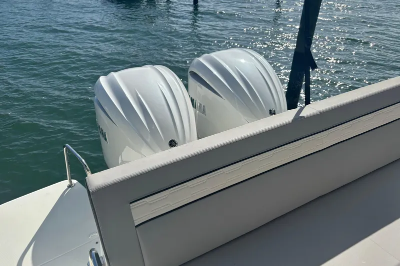 Slide: The Image of 2024 Jeanneau NC Weekender 1095 Fly with dual outboard engines on water. - 6