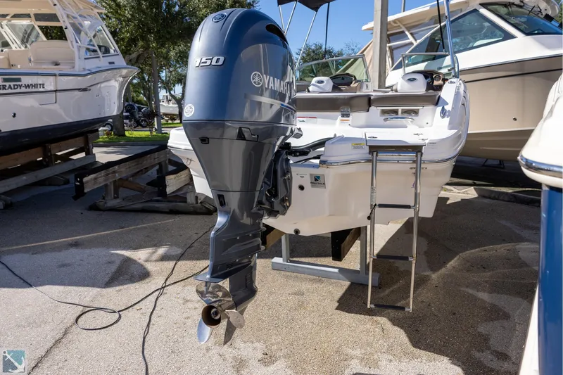 Slide: The Image of 2020 Chaparral 21 SSi OB boat with Yamaha 150 outboard motor on display. - 2