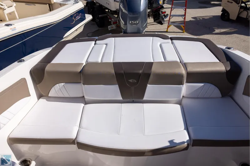 Slide: The Image of 2020 Chaparral 21 SSi OB boat with open storage compartment on deck. - 5