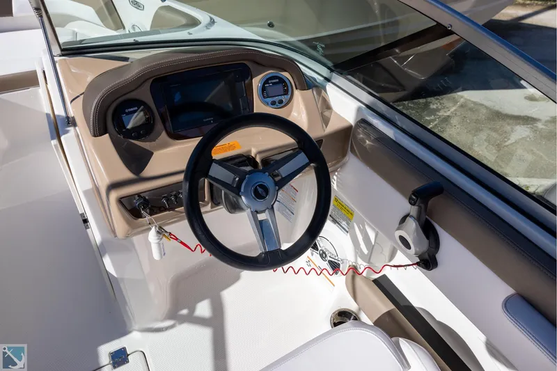 Slide: The Image of 2020 Chaparral 21 SSi OB boat interior with white and brown seating. - 7