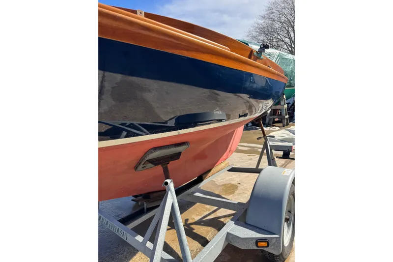 Slide: The Image of 2018 Ballentine's Boat Shop Doughdish on trailer, showcasing sleek hull design. - 13