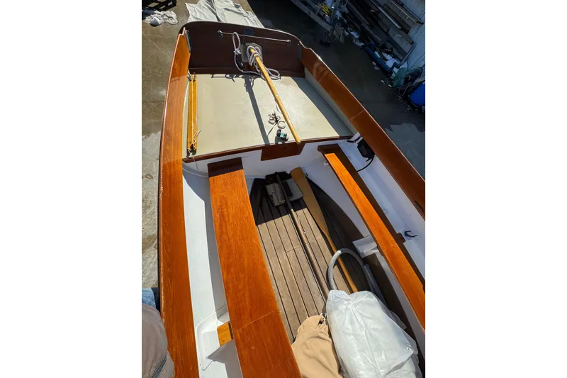 Slide: The Image of 2018 Ballentine's Boat Shop Doughdish interior with wooden seats and deck. - 17