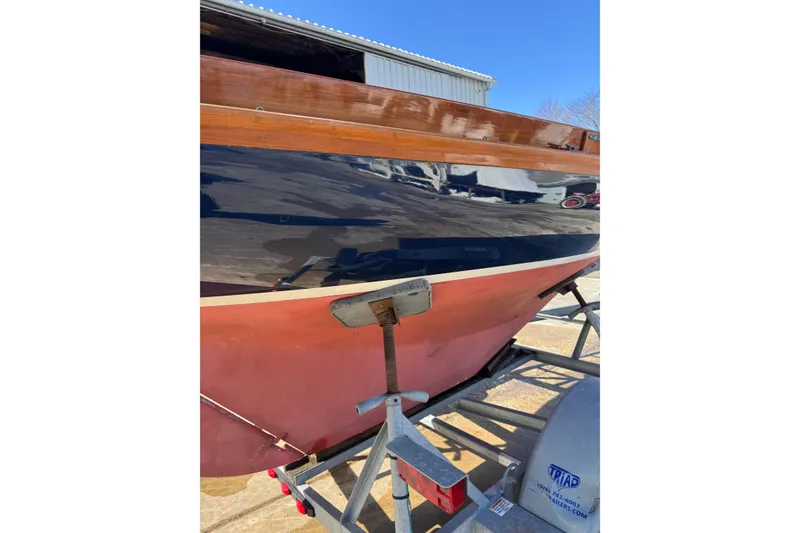 Slide: The Image of 2018 Ballentine's Boat Shop Doughdish sailboat on trailer, showcasing polished hull. - 8