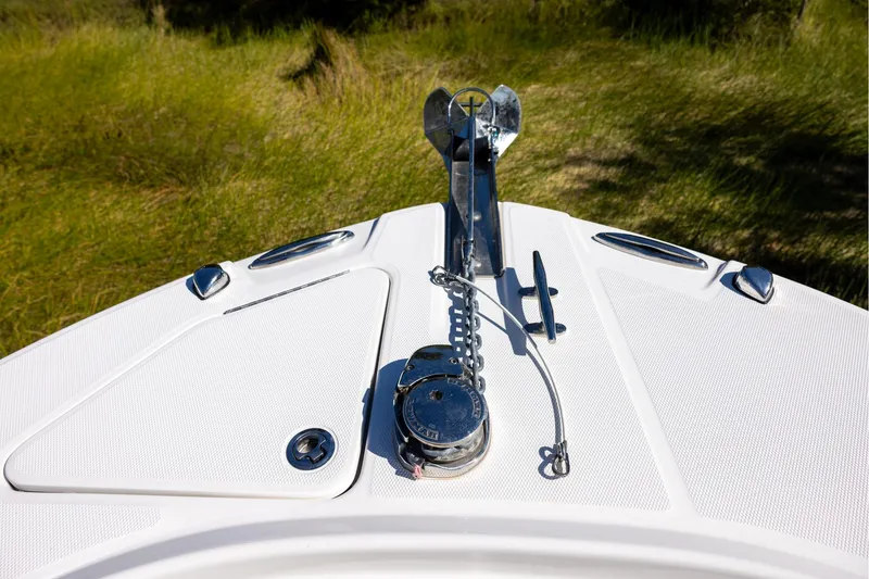 Slide: The Image of Bow of 2023 Edgewater 245CC boat with anchor and deck fittings. - 10