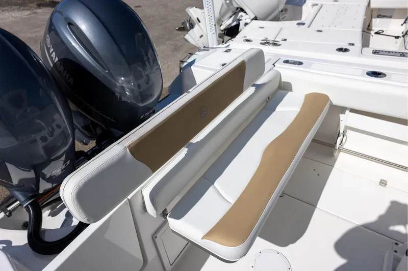 Slide: The Image of 2023 Edgewater 245CC boat with dual Yamaha engines and cushioned seating. - 5