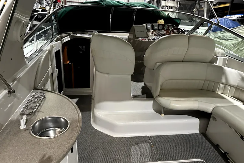 Slide: The Image of 2002 Four Winns 378 Vista boat interior with seating, sink, and control panel. - 16
