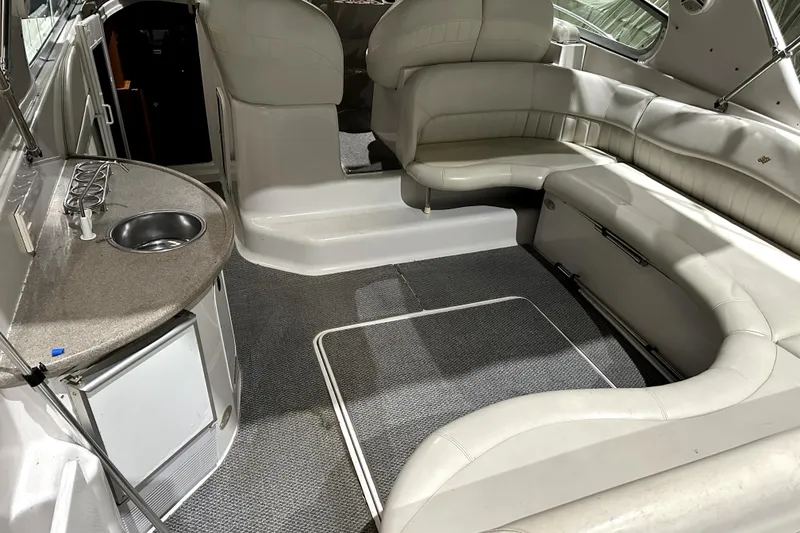 Slide: The Image of 2002 Four Winns 378 Vista boat interior with seating, kitchenette, and sink. - 19