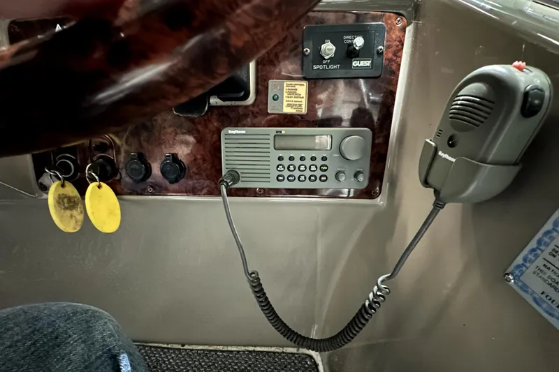 Slide: The Image of Control panel of a 2002 Four Winns 378 Vista boat with radio and microphone. - 25