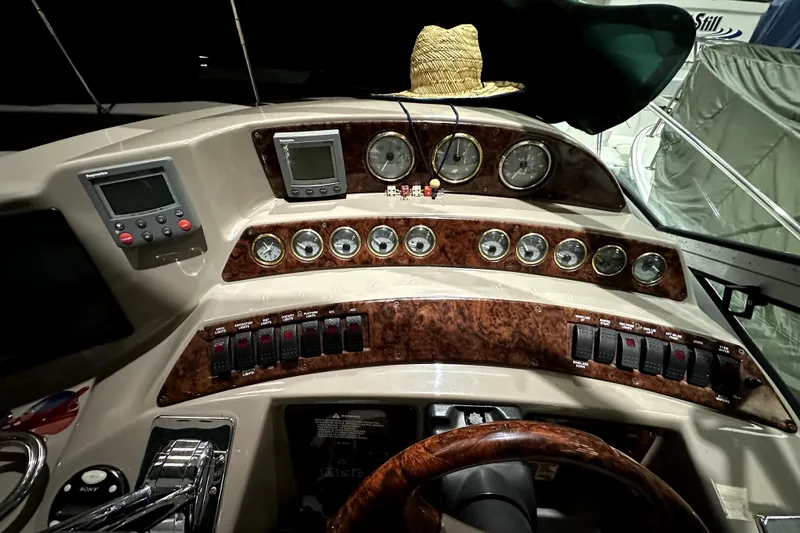 Slide: The Image of Control panel of 2002 Four Winns 378 Vista boat with gauges and switches. - 26