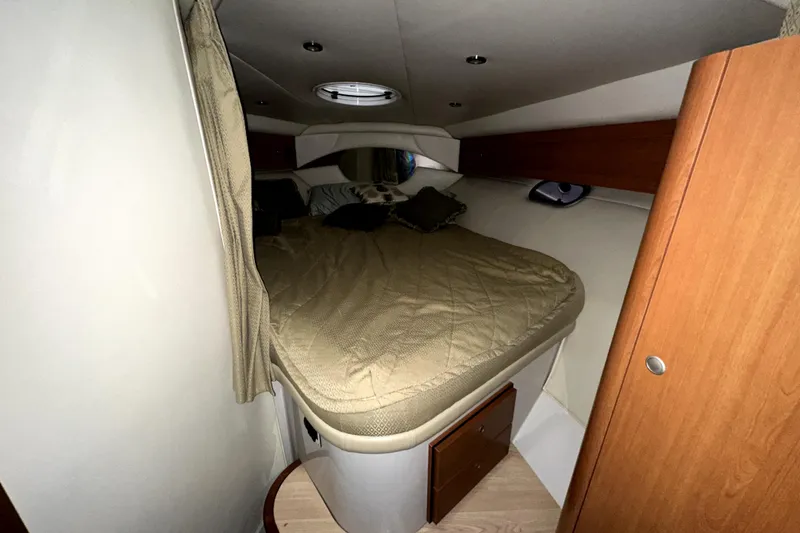 Slide: The Image of Cozy cabin interior of 2002 Four Winns 378 Vista yacht with bed and wood accents. - 28