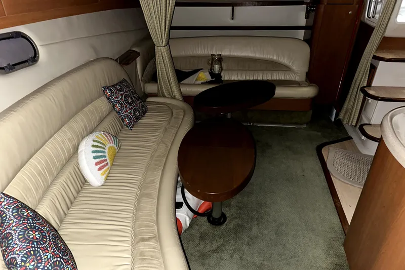 Slide: The Image of Interior of 2002 Four Winns 378 Vista yacht with beige seating and decorative pillows. - 32
