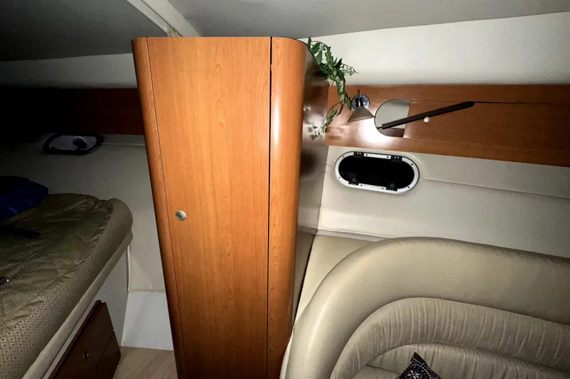Slide: The Image of Interior of 2002 Four Winns 378 Vista boat with wood cabinet and seating area. - 39