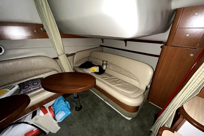 Slide: The Image of Interior of 2002 Four Winns 378 Vista yacht with beige seating and wooden accents. - 41