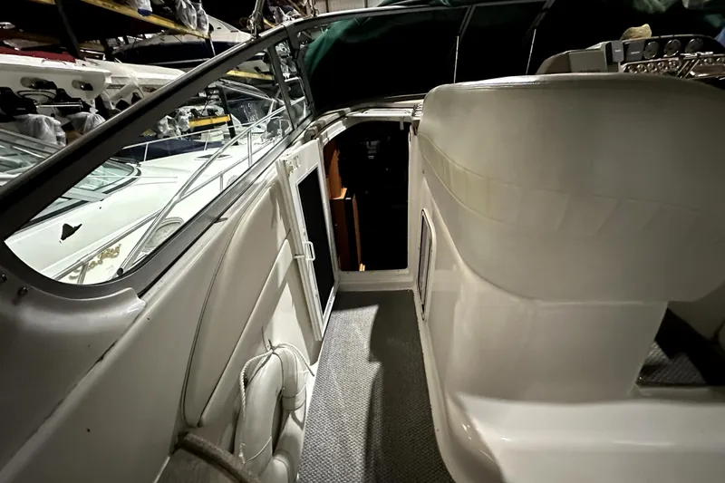 Slide: The Image of 2002 Four Winns 378 Vista boat interior with seating and open cabin door. - 42