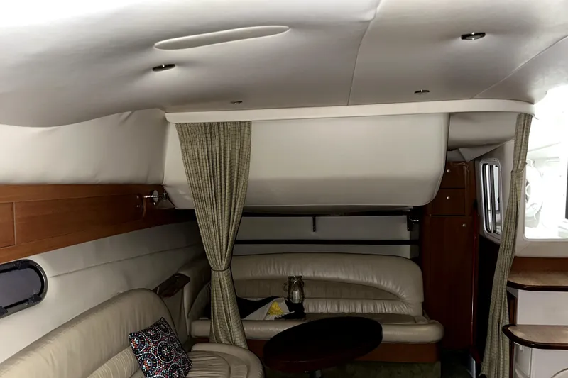 Slide: The Image of Interior of 2002 Four Winns 378 Vista yacht with leather seating and wooden accents. - 45