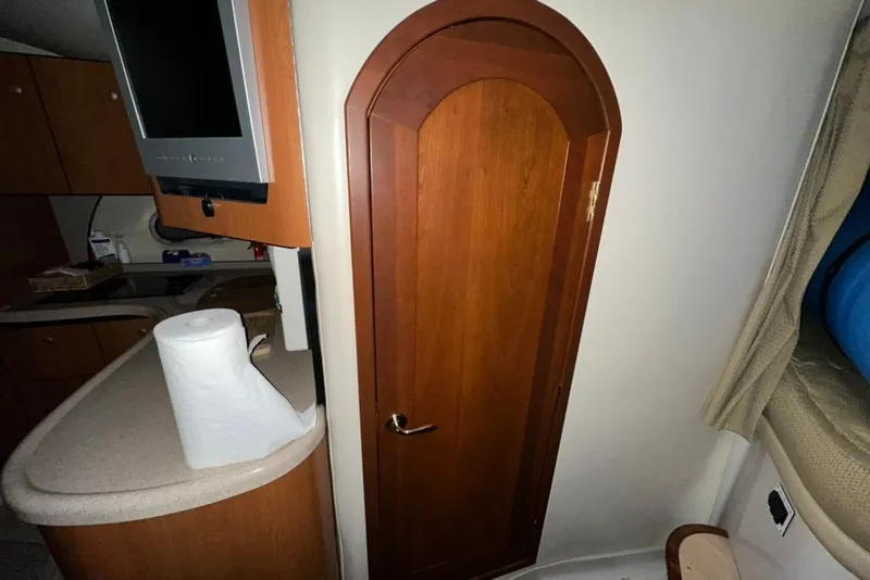 Slide: The Image of Interior of 2002 Four Winns 378 Vista boat with wooden door and countertop. - 46