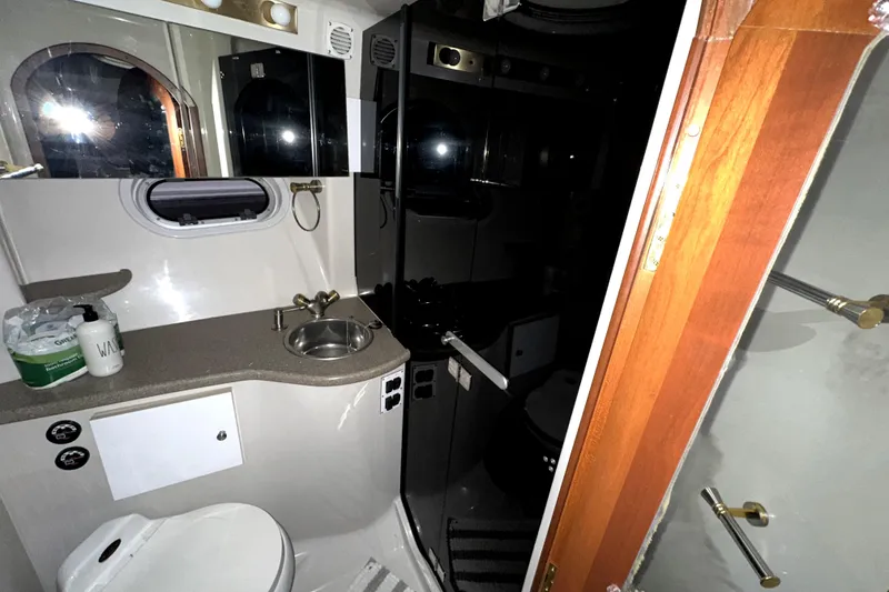 Slide: The Image of Bathroom interior of 2002 Four Winns 378 Vista yacht, featuring sink and toilet. - 47