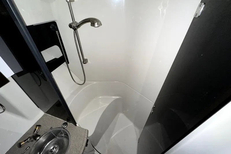 Slide: The Image of Shower area in 2002 Four Winns 378 Vista boat, featuring modern fixtures and compact design. - 48