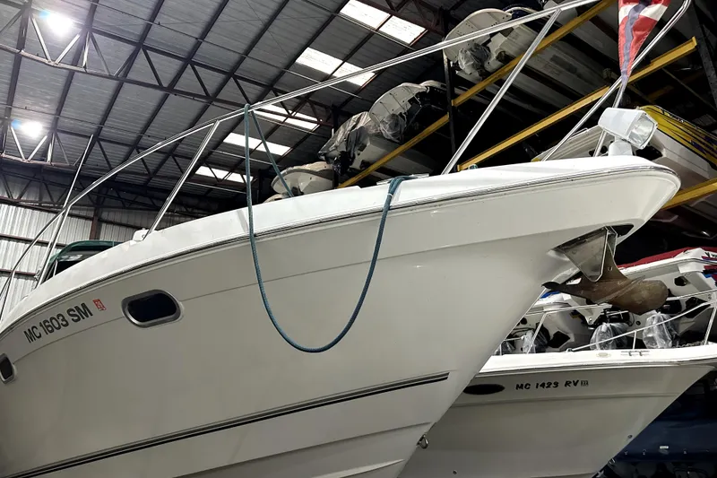 Slide: The Image of 2002 Four Winns 378 Vista boat stored in a warehouse, side view. - 5