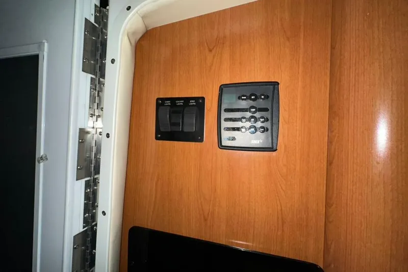 Slide: The Image of Control panel on 2002 Four Winns 378 Vista boat with wood finish. - 55