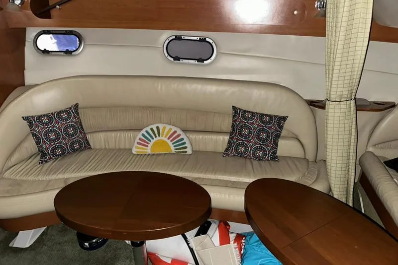 Slide: The Image of Interior of 2002 Four Winns 378 Vista yacht with beige seating and decorative pillows. - 59