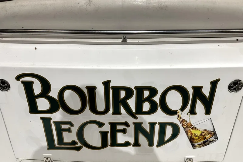 Slide: The Image of 2002 Four Winns 378 Vista boat with 'Bourbon Legend' graphic and whiskey glass design. - 63